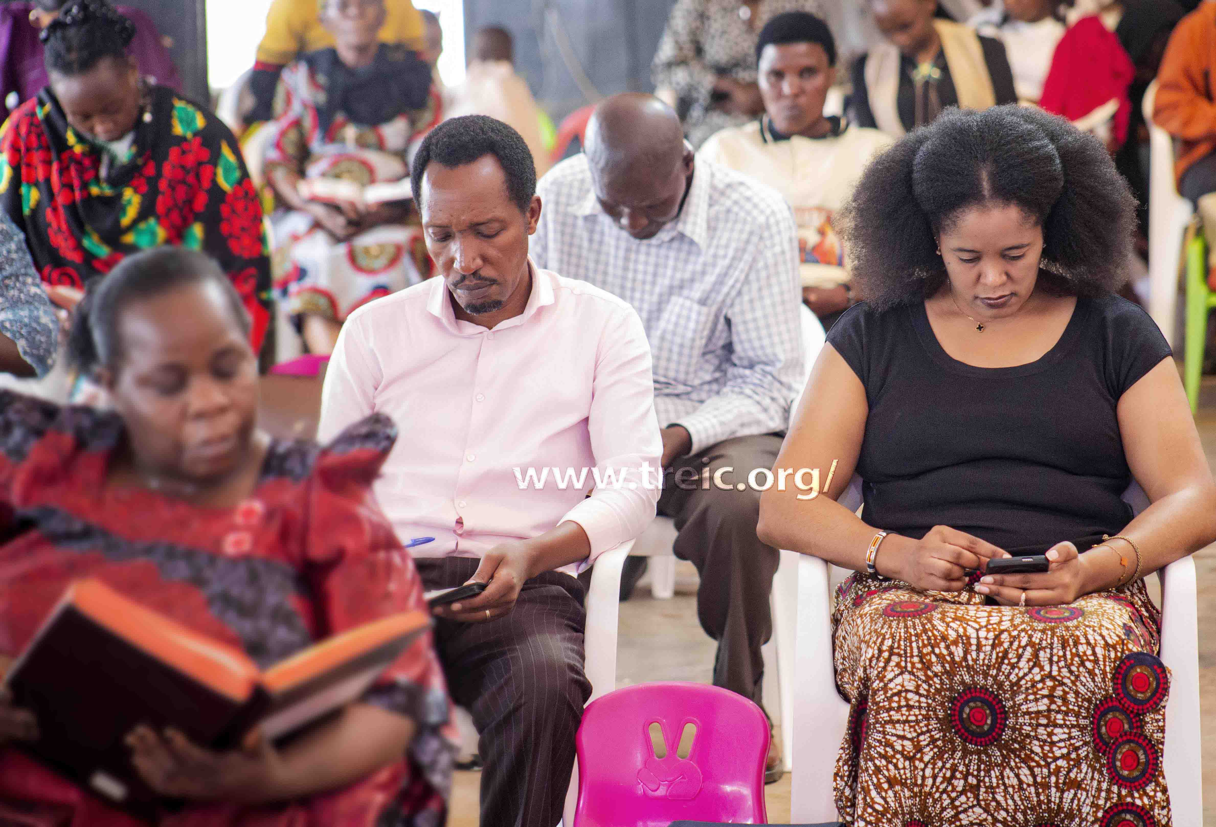 People of God share the word by reading through their Bibles, as they listen to the preaching